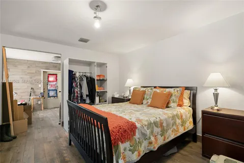 a bed room with a bed and a window