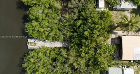 a lake view with tables and chairs