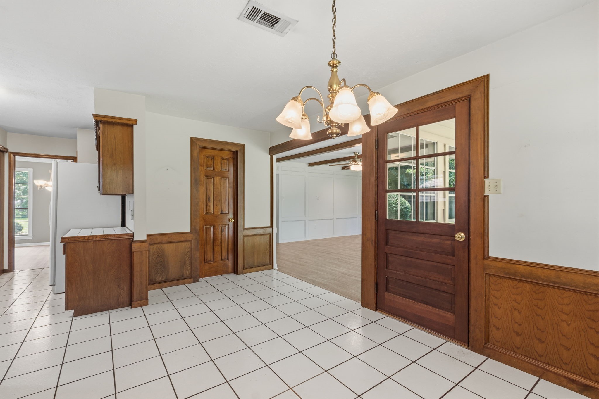 3422 Candlewisp Drive Spring, TX 77388 - Photo 16 of 50 BREAKFAST ROOM - This view shows the kitchen to the left, and the family room to the right. The doorway in the center of the photo leads to the powder room.