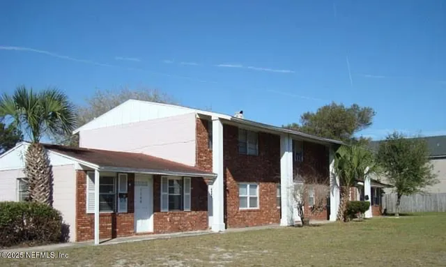 a view of a white house with a large windows