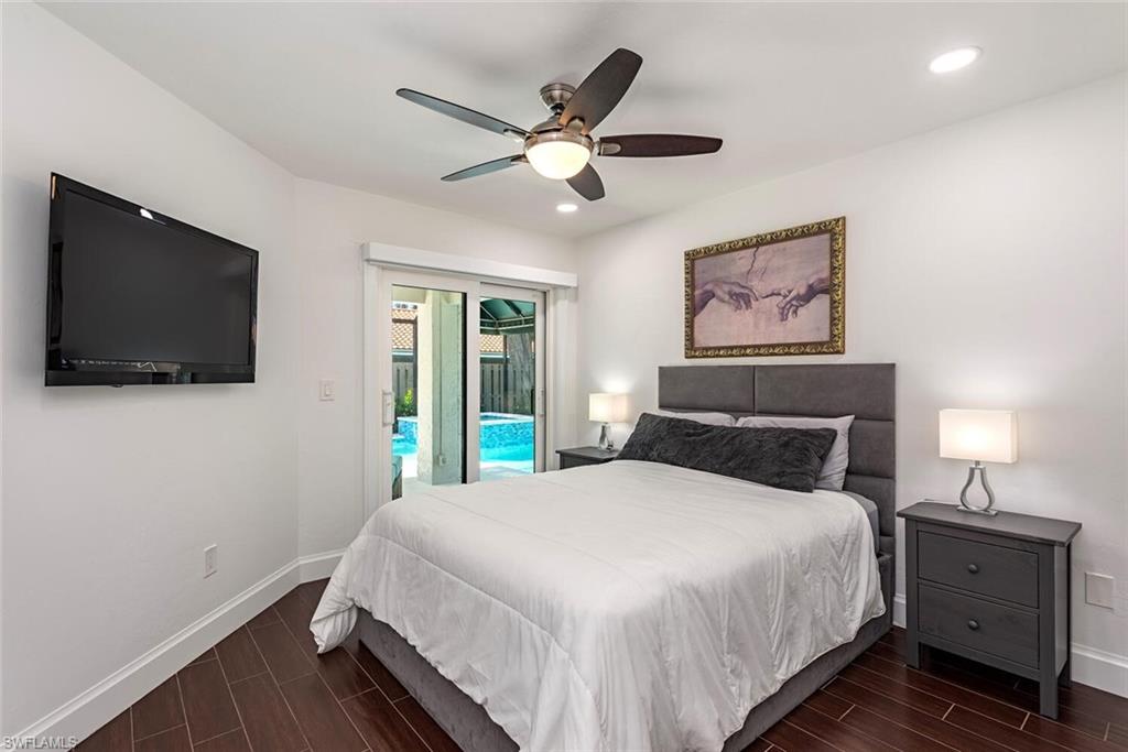 748 Reef Point Circle Naples, FL 34108 - Photo 15 of 23 Bedroom featuring wood tiled floors, access to exterior, ceiling fan, and recessed lighting