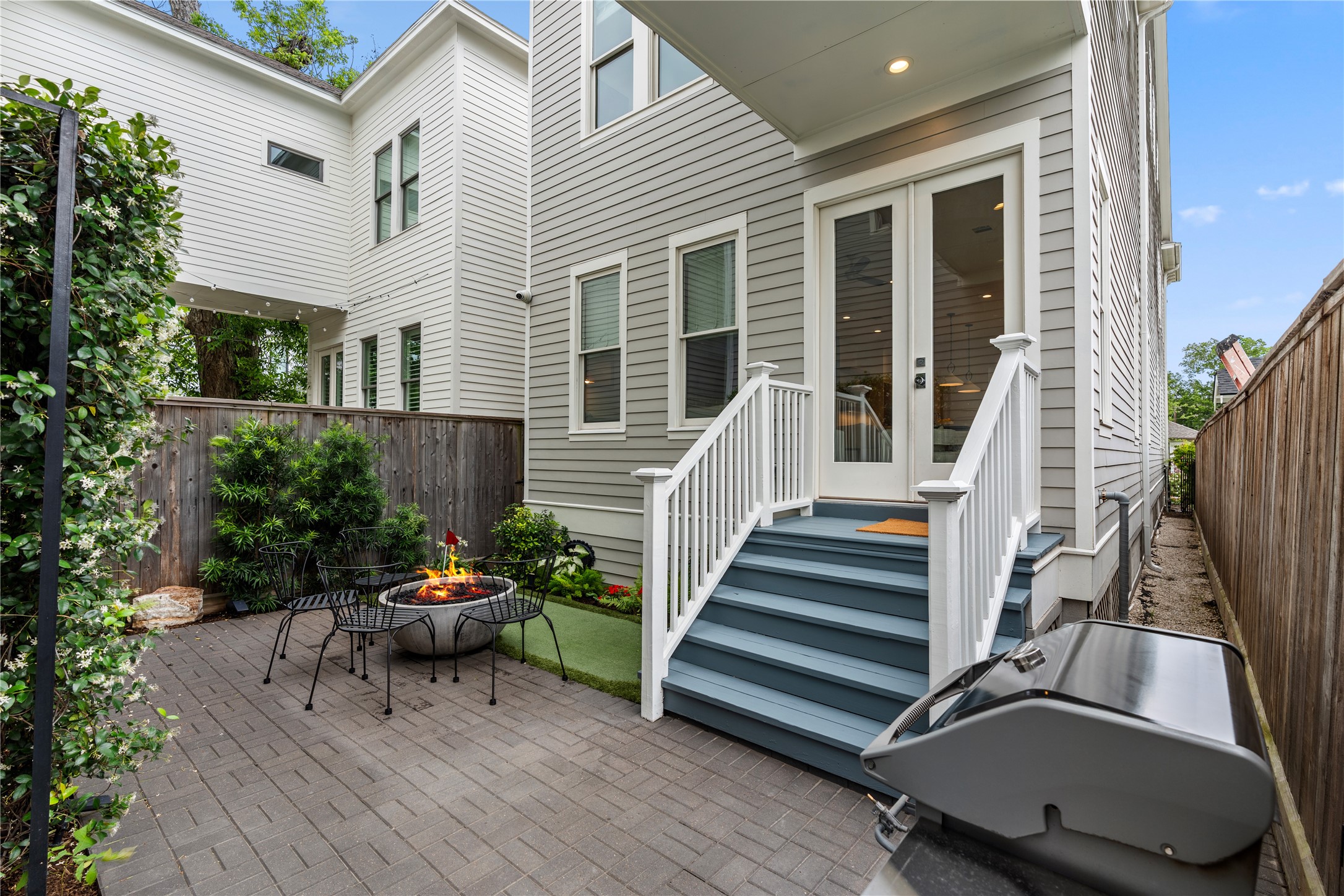 925 Tulane Street, Unit A Houston, TX 77008 - Photo 24 of 49 From the family room , you’re welcomed to the fully fenced yard featuring Belgard pavers and putting green.