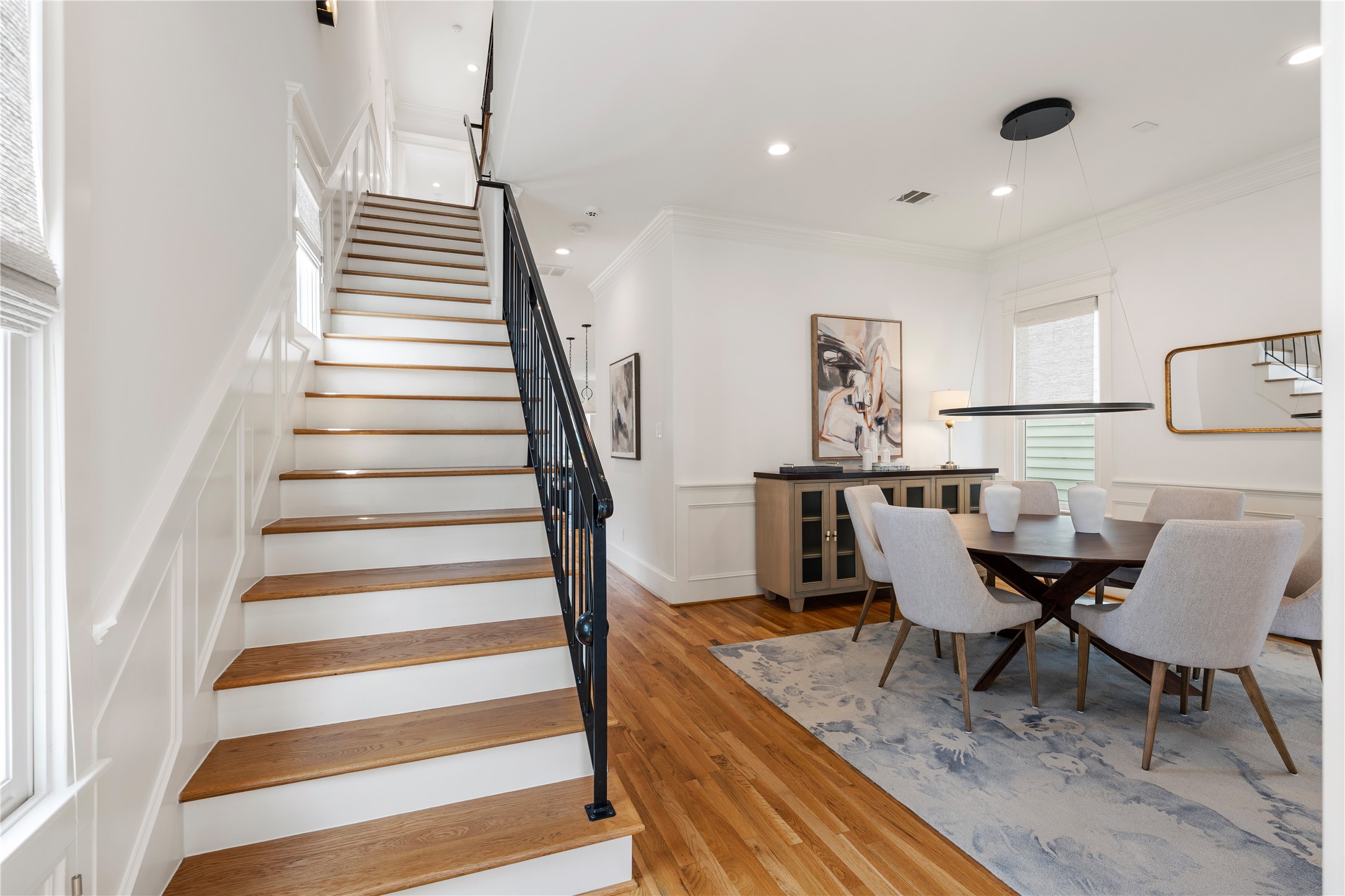925 Tulane Street, Unit A Houston, TX 77008 - Photo 27 of 49 The beautiful wrought iron staircase ushers you upstairs, where you’ll find four spacious and bright en suite bedrooms.
