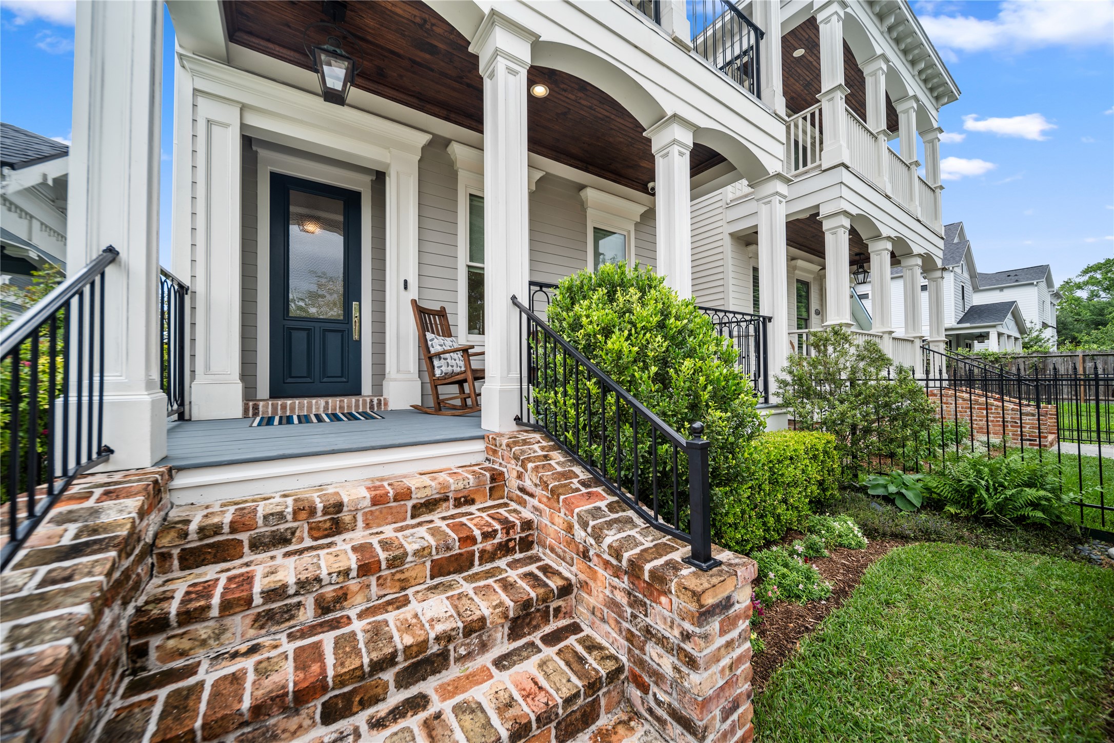 925 Tulane Street, Unit A Houston, TX 77008 - Photo 5 of 49 Newer custom iron railings on both porches, a covered front entry, and beautiful brickwork give this contemporary Heights home timeless curb appeal.