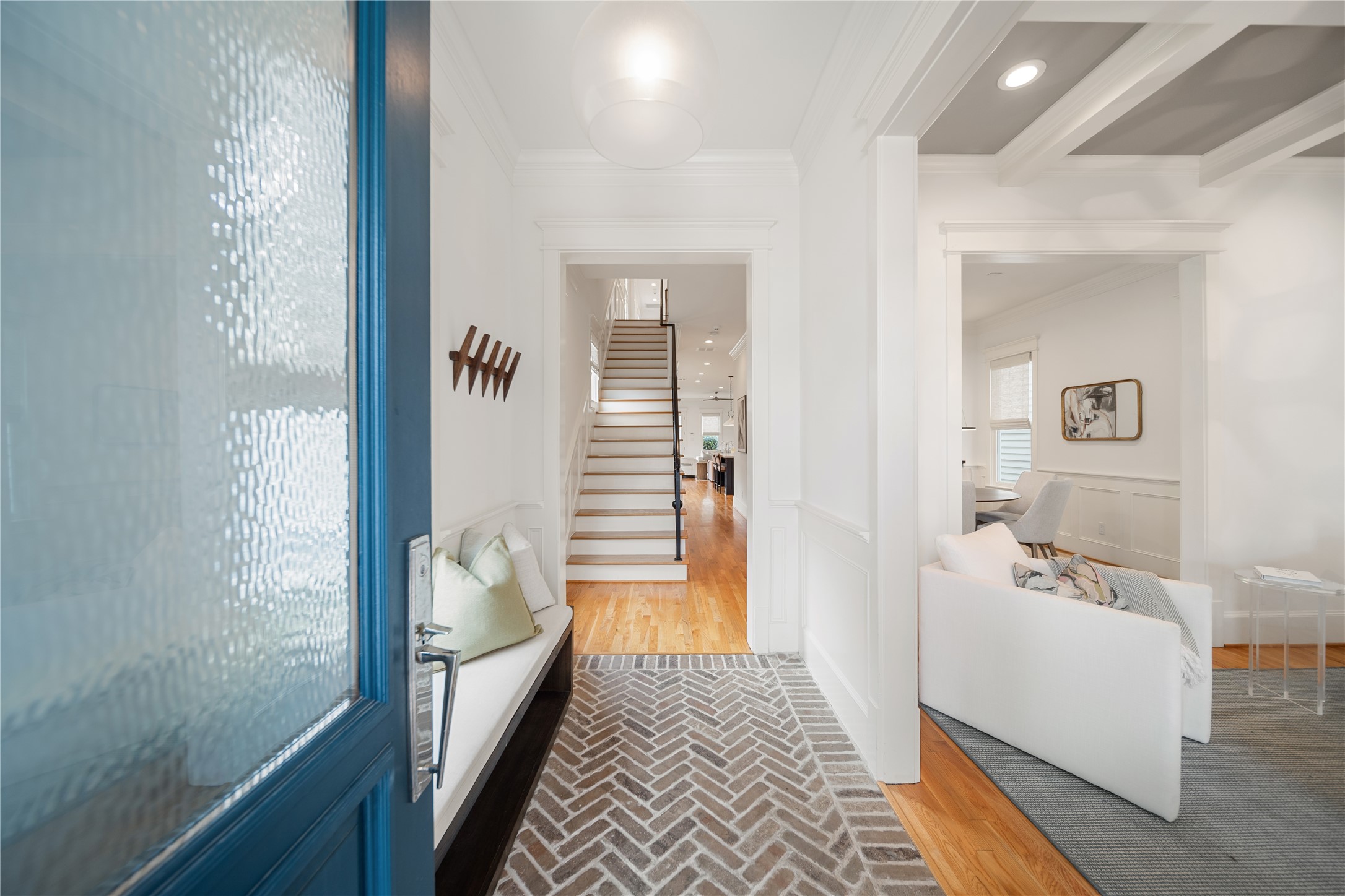 925 Tulane Street, Unit A Houston, TX 77008 - Photo 7 of 49 A glass-inset teal entry door welcomes you into a foyer paved in whitewashed custom herringbone brick entrance.
