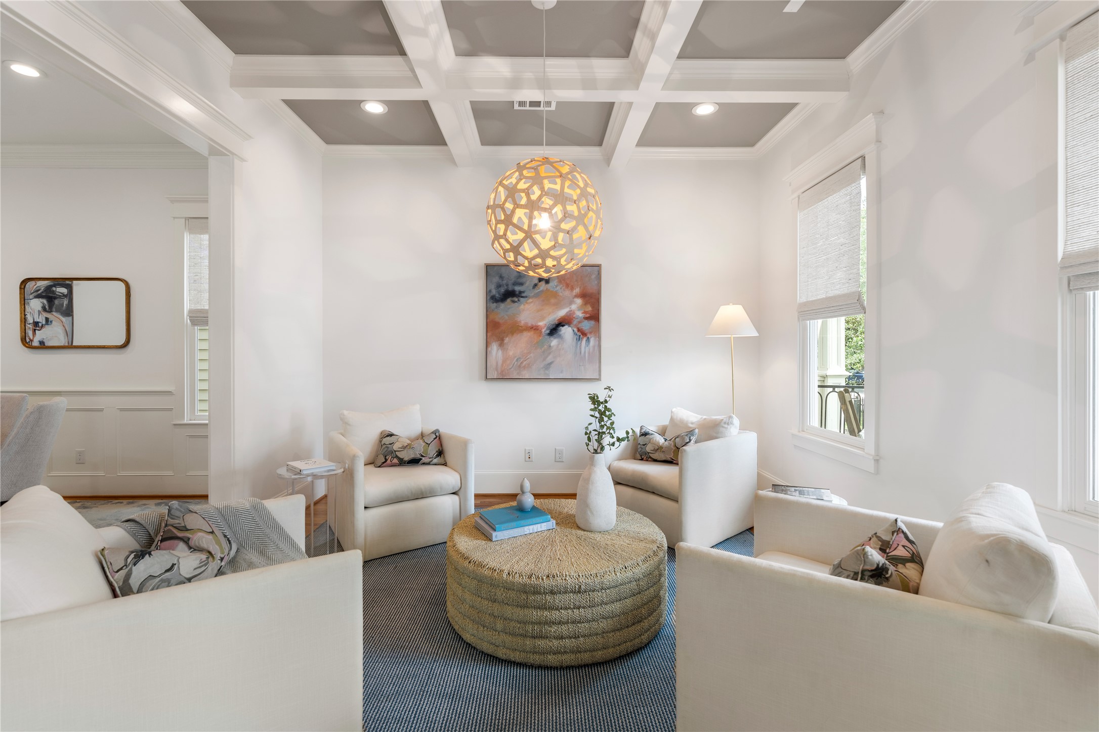 925 Tulane Street, Unit A Houston, TX 77008 - Photo 9 of 49 The formal living room impresses with coffered ceilings dotted with recessed lighting and a Coral by David Trubridge light fixture.