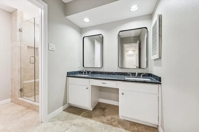 a bathroom with mirror a sink and a mirror