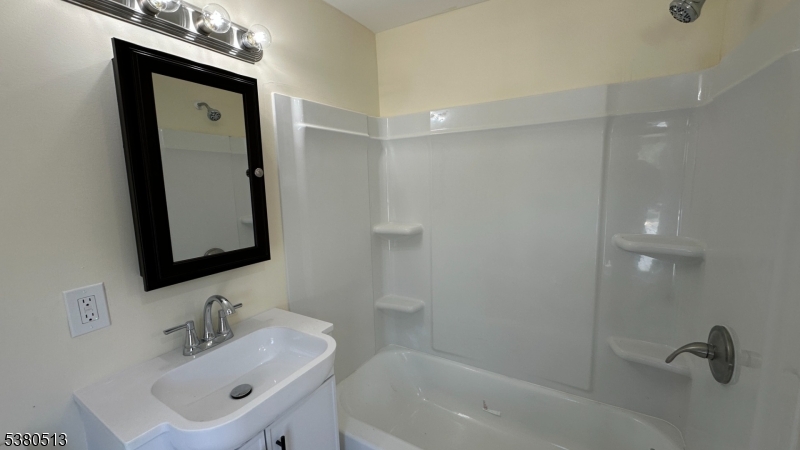 470 Highway 57 Washington, NJ 07882 - Photo 5 of 26 a bathroom with a sink a mirror and a shower