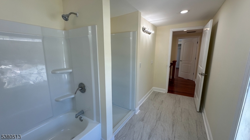 470 Highway 57 Washington, NJ 07882 - Photo 6 of 26 a bathroom with a sink and a glass door shower