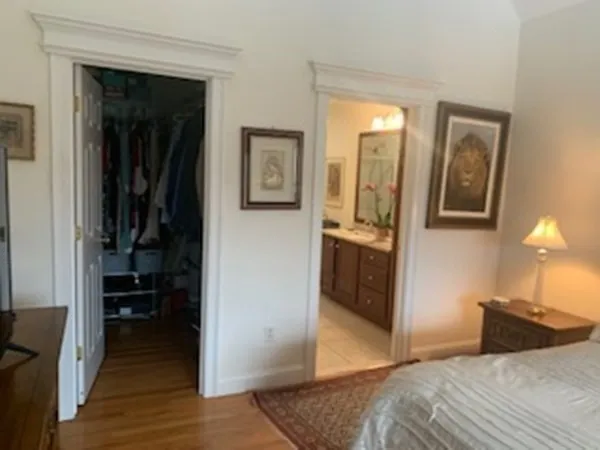 a bedroom with a bed and a view of bedroom