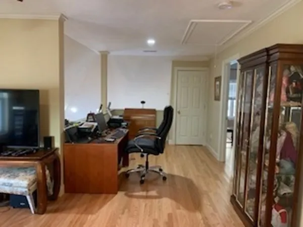 a work room with furniture and wooden floor