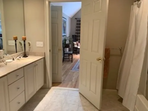 a bathroom with a sink and mirror