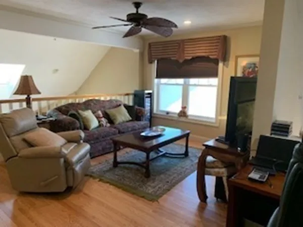 a living room with furniture a table and a window