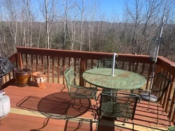 a view of a chairs and table in the outdoor