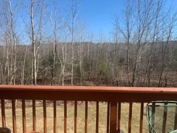 a view of a balcony with trees