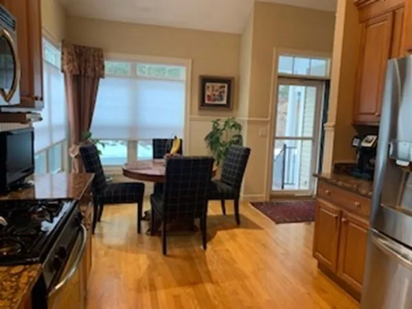 a dining room with furniture and window