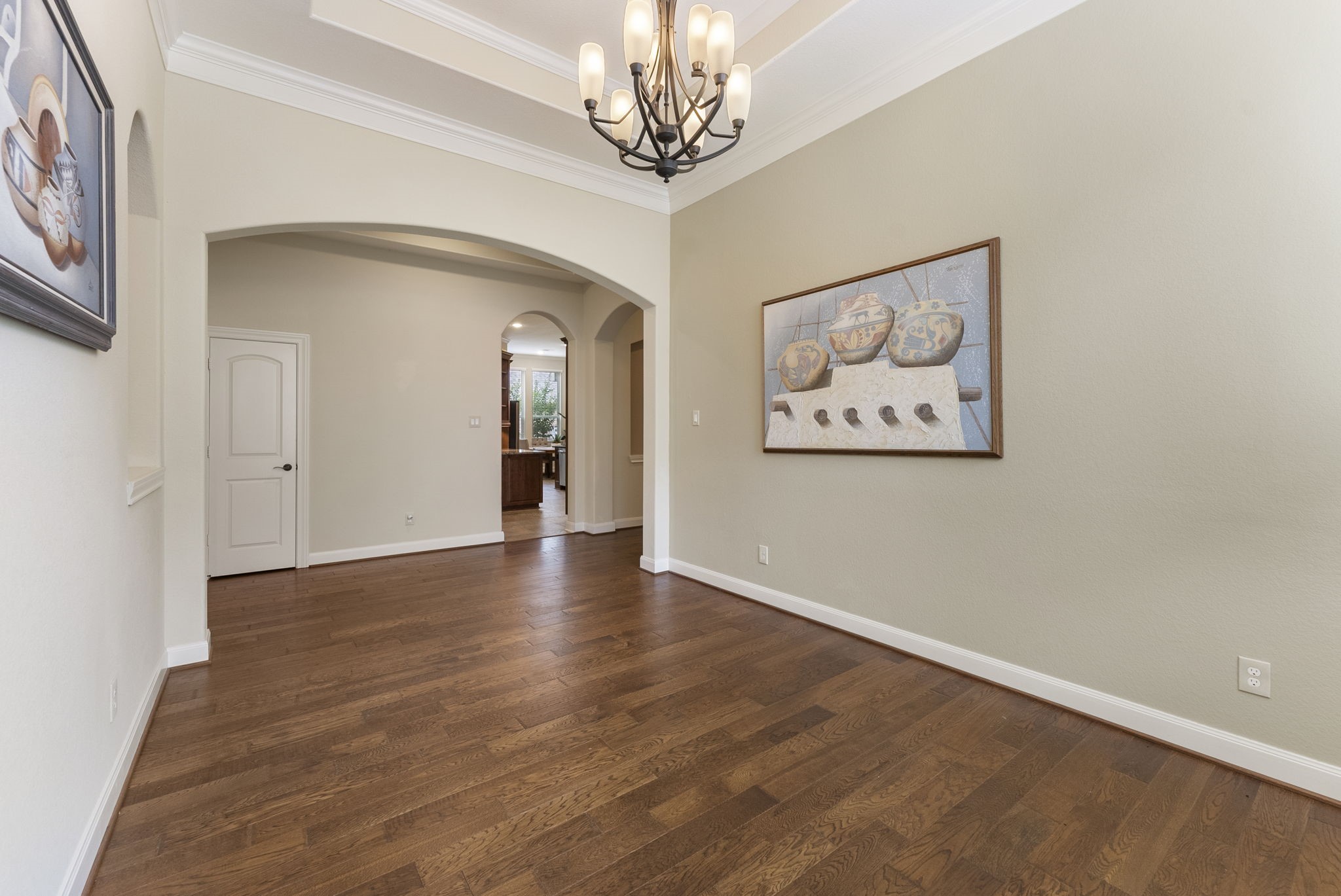 4787 Jackson Square Drive Conroe, TX 77304 - Photo 14 of 35 This dining room is as versatile as it is enchanting. The rich warmth of hardwood floors sets the stage, while a stunning wall of windows bathes the space in natural light, creating a bright and inviting atmosphere. Whether you're hosting a festive holiday gathering or enjoying an intimate dinner for two, this space effortlessly adapts to your needs. With its blend of elegance and functionality, this dining room is ready to be the heart of your most memorable moments.