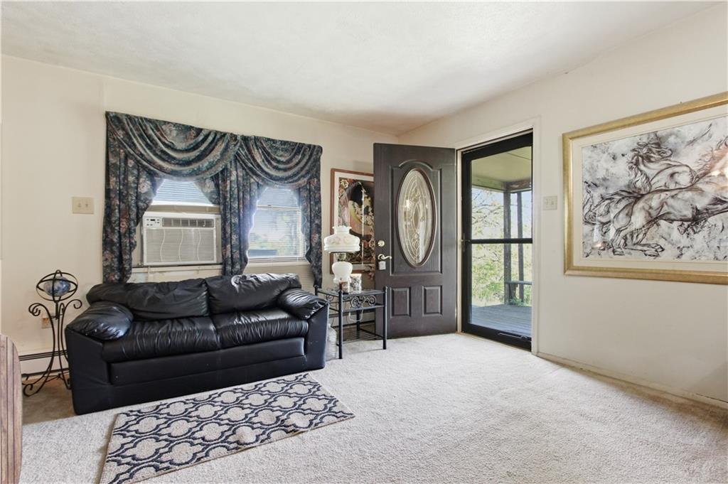 776 Fraction Road West Finley, PA 15377 - Photo 12 of 43 a living room with furniture a window and a chandelier