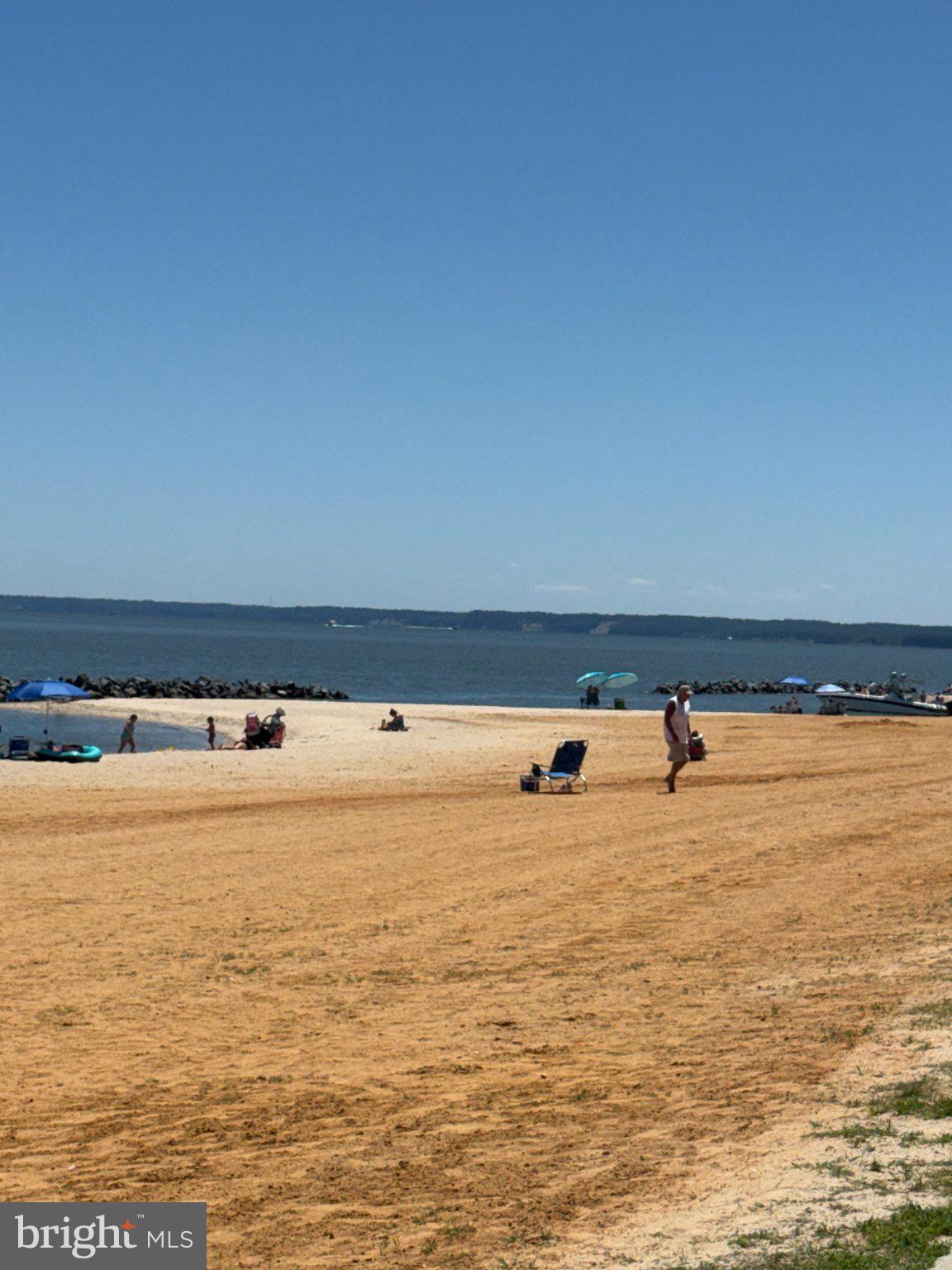 32 Placid Road Colonial Beach, VA 22443 - Photo 76 of 80 Sunny beach day by the calm sea.