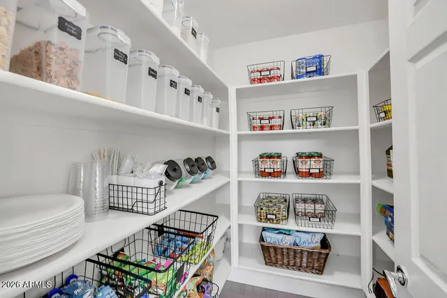 a bedroom with furniture and a book shelf