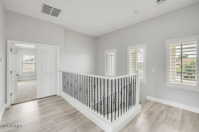 a view of hallway with windows