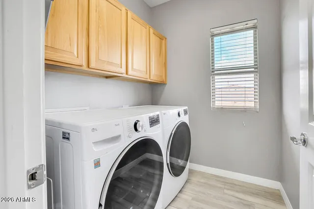 a utility room with dryer and washer