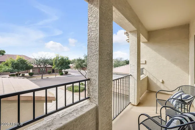 a view of a balcony with furniture