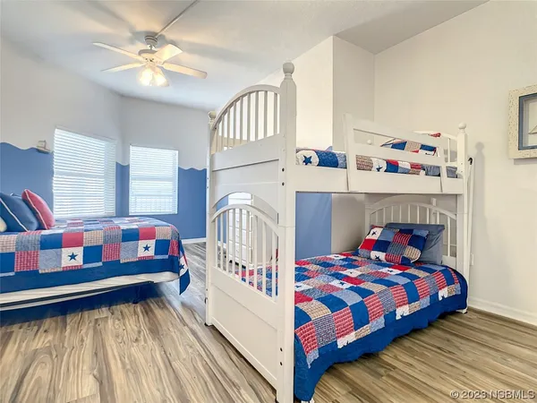 a bedroom with a bed and a small dresser