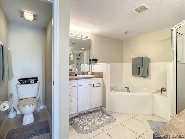 a bathroom with a sink toilet tub and shower