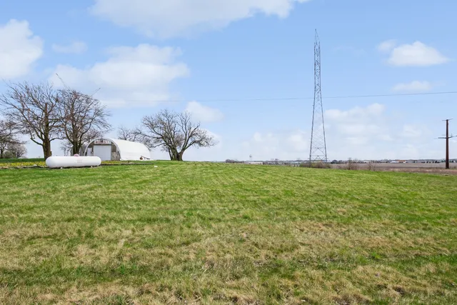 a view of a garden with tall buildings
