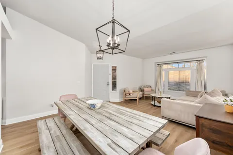 a living room with a bed furniture and a window