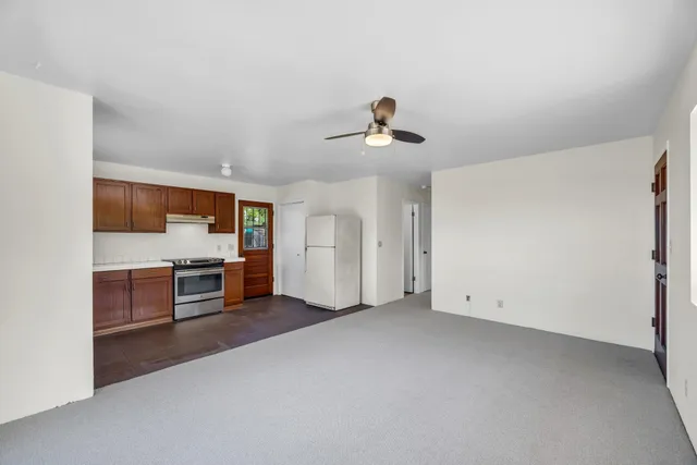 a view of a livingroom with furniture and windows
