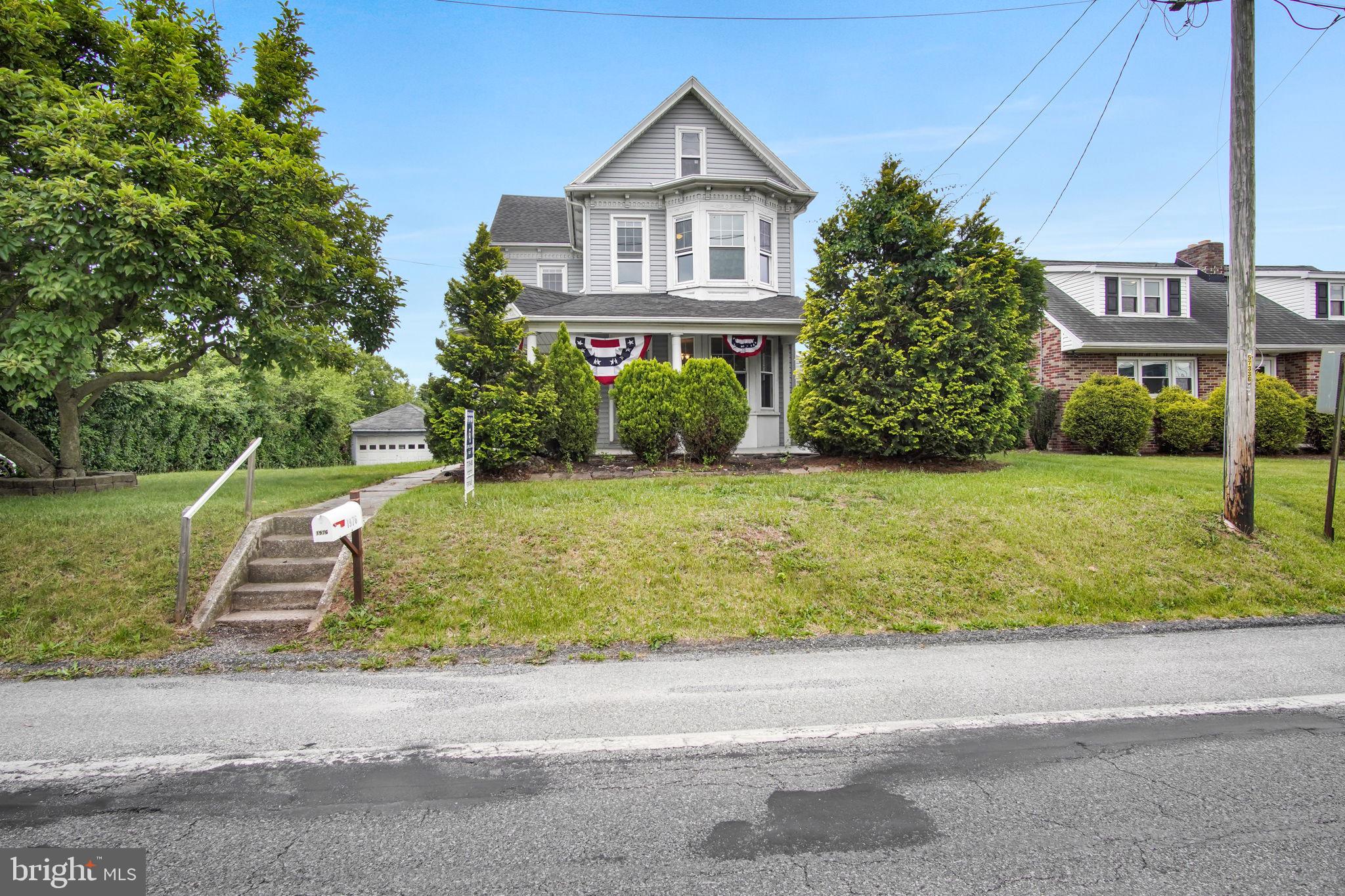 1976 Carlisle Road York, PA 17408 - Photo 2 of 39 Charming vintage home with lush greenery.