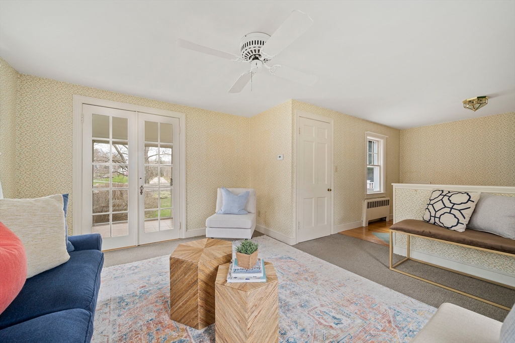 10 Robin Road Westwood, MA 02090 - Photo 19 of 37 a spacious bedroom with a bed and wooden floor