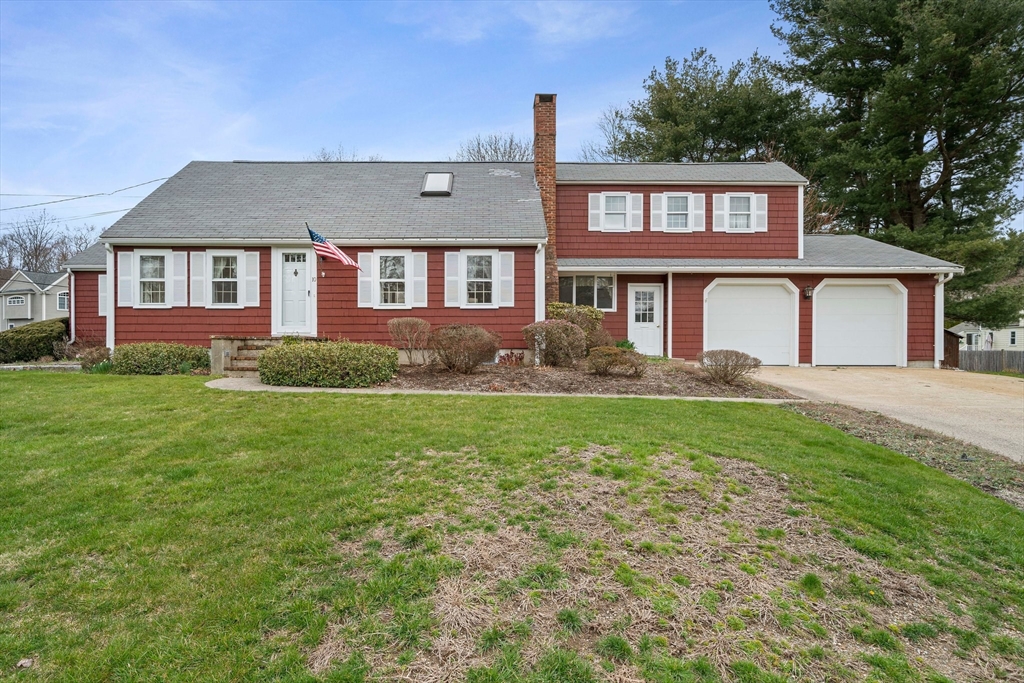 10 Robin Road Westwood, MA 02090 - Photo 2 of 37 a front view of a house with a garden