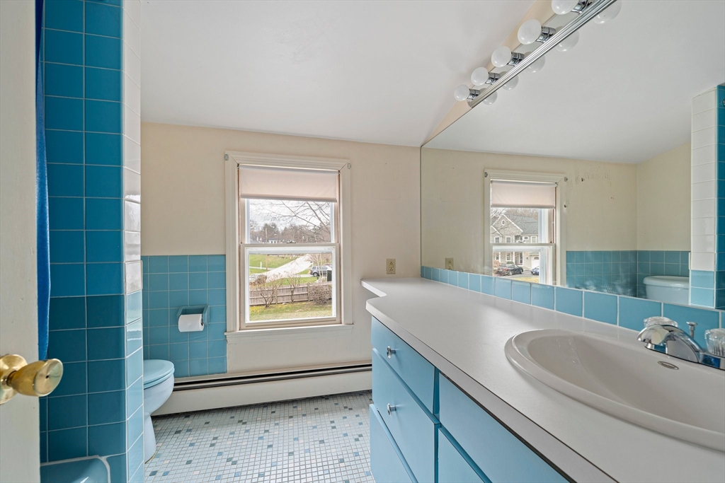 10 Robin Road Westwood, MA 02090 - Photo 24 of 37 a bathroom with a sink and a bathtub