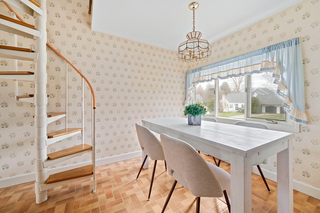 10 Robin Road Westwood, MA 02090 - Photo 5 of 37 a view of a dining room with furniture window and outside view