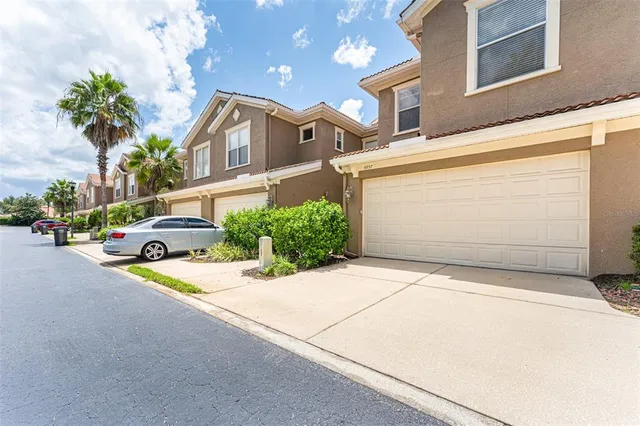 a view of a street with cars parked in front of it