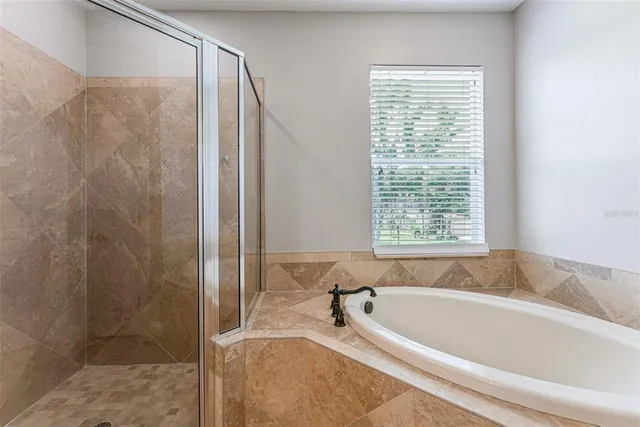 a view of a house with backyard and garden