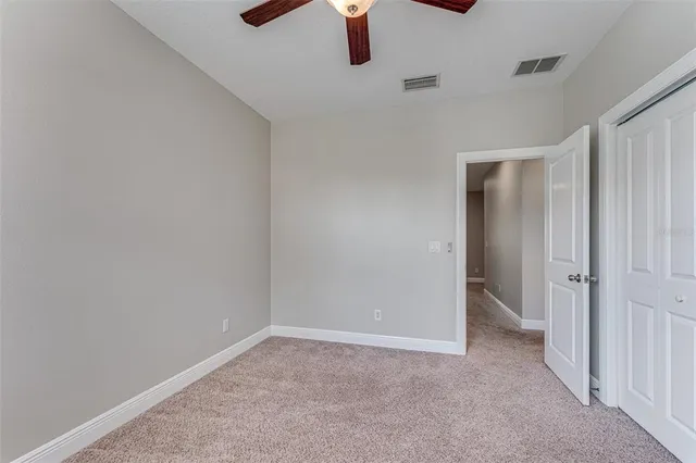 an aerial view of residential houses with outdoor space and lake view