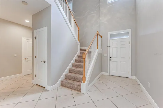 a view of entryway with stairs and wooden floor