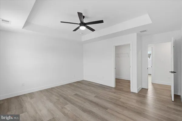 a view of a room with wooden floor