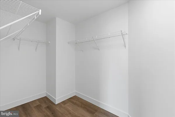 a bathroom with a shower sink and mirror