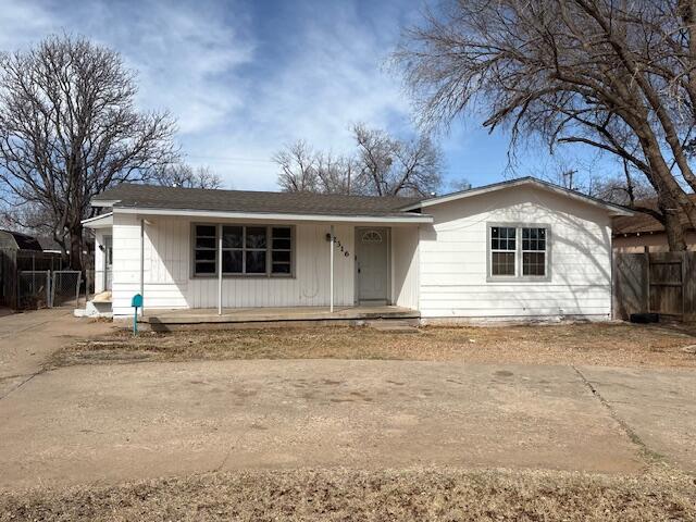 2316 38th Street Lubbock, TX 79412 - Photo 1 of 11 a front view of a house with a garden