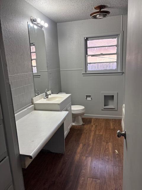 2316 38th Street Lubbock, TX 79412 - Photo 4 of 11 a bathroom with a sink a toilet and mirror