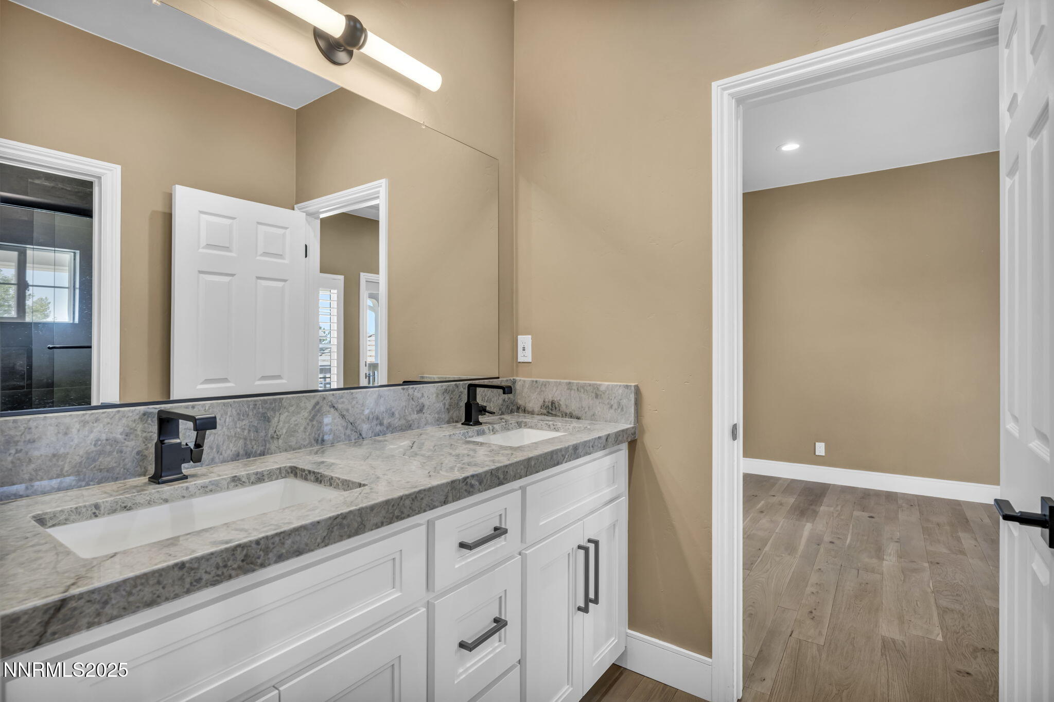 2965 Roundrock Court Reno, NV 89511 - Photo 29 of 119 a bathroom with a granite countertop sink and a mirror