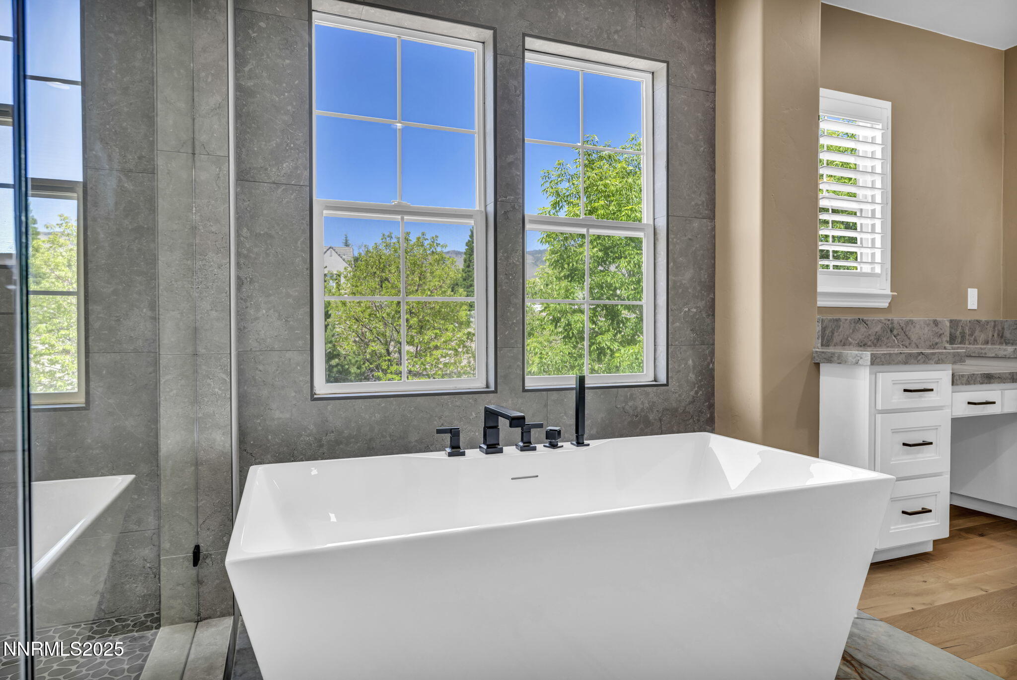 2965 Roundrock Court Reno, NV 89511 - Photo 66 of 119 a white bath tub sitting in a bathroom next to a window