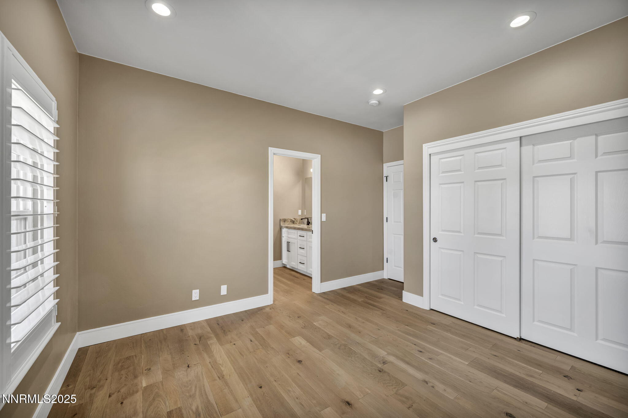 2965 Roundrock Court Reno, NV 89511 - Photo 68 of 119 an empty room with wooden floor and windows