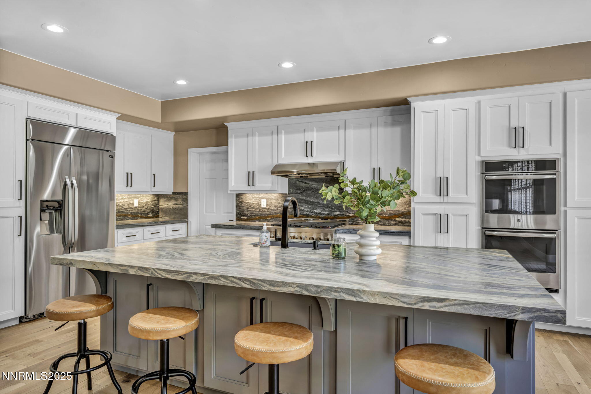 2965 Roundrock Court Reno, NV 89511 - Photo 78 of 119 a kitchen with stainless steel appliances granite countertop a table chairs stove refrigerator and microwave