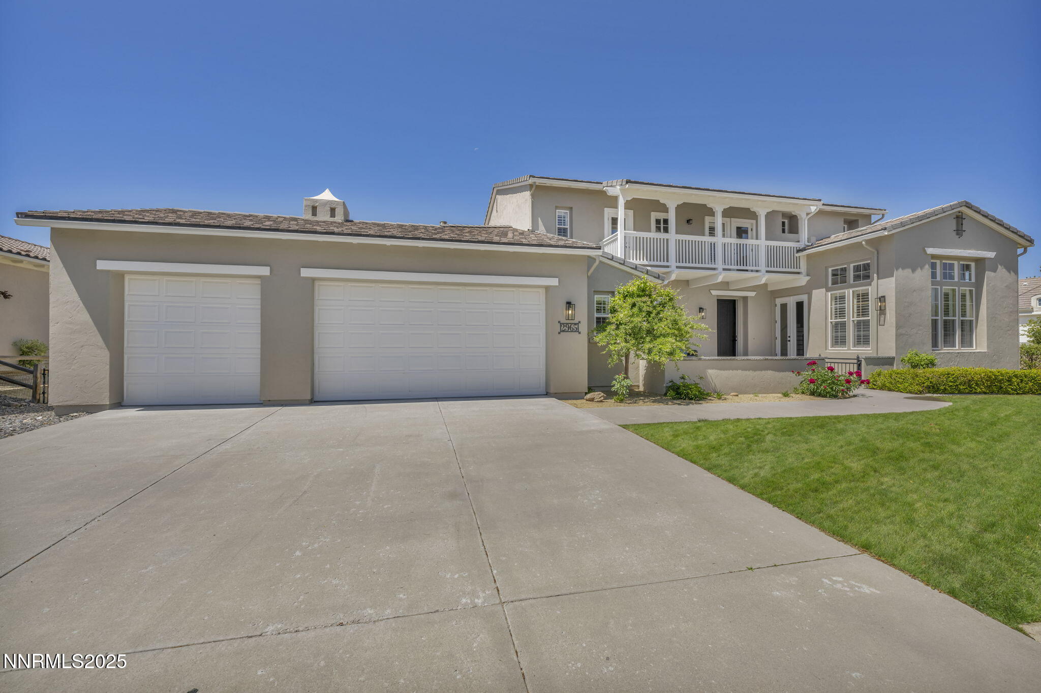 2965 Roundrock Court Reno, NV 89511 - Photo 96 of 119 a front view of a house with a yard and garage